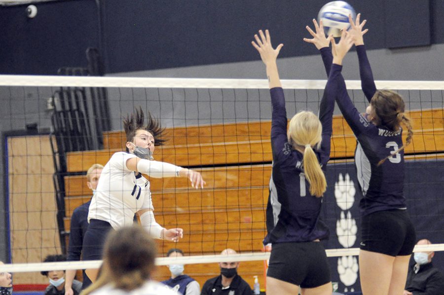 Madison College’s Jadyn Holman hits a ball off two Joliet Junior College blockers for one of her team-record 25 kills during a 3-1 victory at home on Oct. 21. Holman was one of six players recognized during sophomore night.