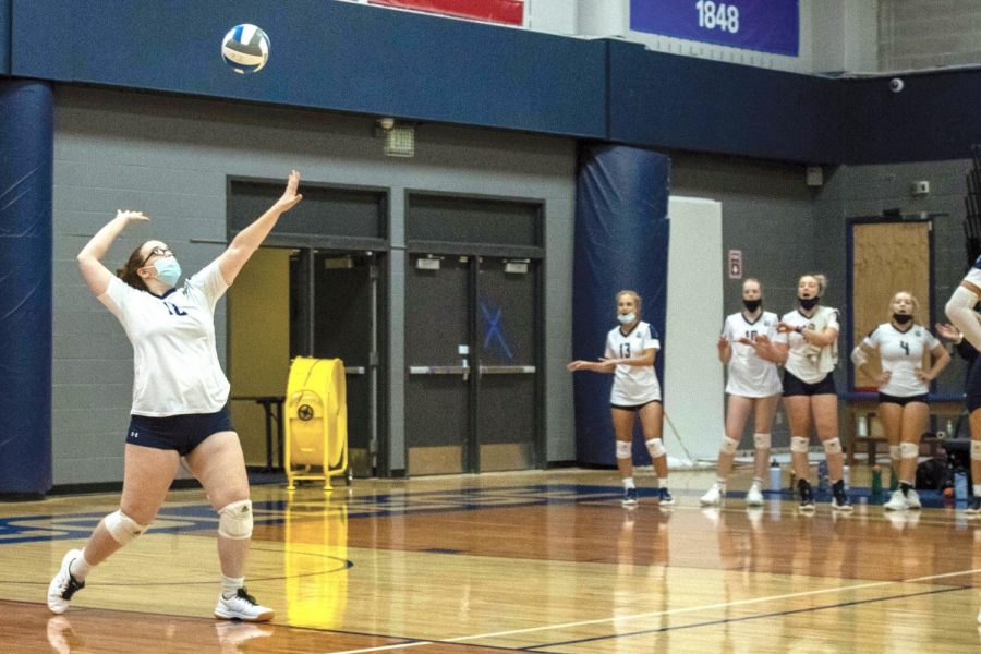 Madison Colleges Taleise Lawrence serves against Bryant and Stratton College.