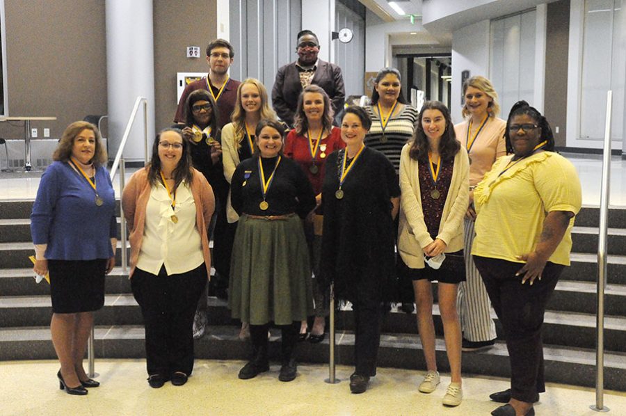 Students+who+attended+the+PTK+Induction+Ceremony+gather+for+a+photograph.