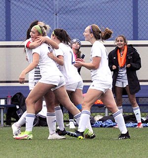 Madison College’s Paris Rose (8) is mobbed by teammates after scoring the only goal in a 1-0 win over Rochester on Oct. 28.