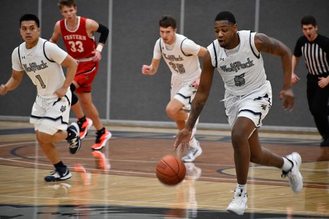Madison College guard Telin Porter (5) brings the ball up court during a recent home game. The WolfPack men’s basketball team has won six straight games as it prepares for the start of conference play.