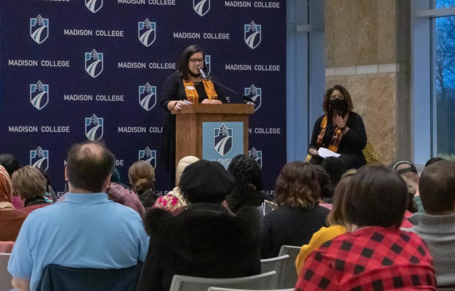 Jodie Pope Williams, left, and Rhoda McKinney, members of the Black Women’s Affinity Group at Madison College, share the stage during the opening of the art exhibit “Honoring the Black Woman” on Feb. 1 at the Truax Campus.