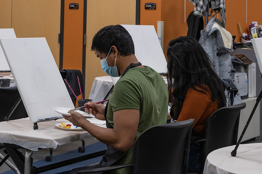 Students begin working on their paintings during the Ruby Bridges Paint Party in the Intercultural Exchange at the Truax Campus to kick off Black History Month activities.