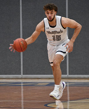 Madison College’s Keith Hoffman (15) drives up court during a game earlier this year. Hoffman led the WolfPack in scoring this year, after returning to the sport after an eight-year break.