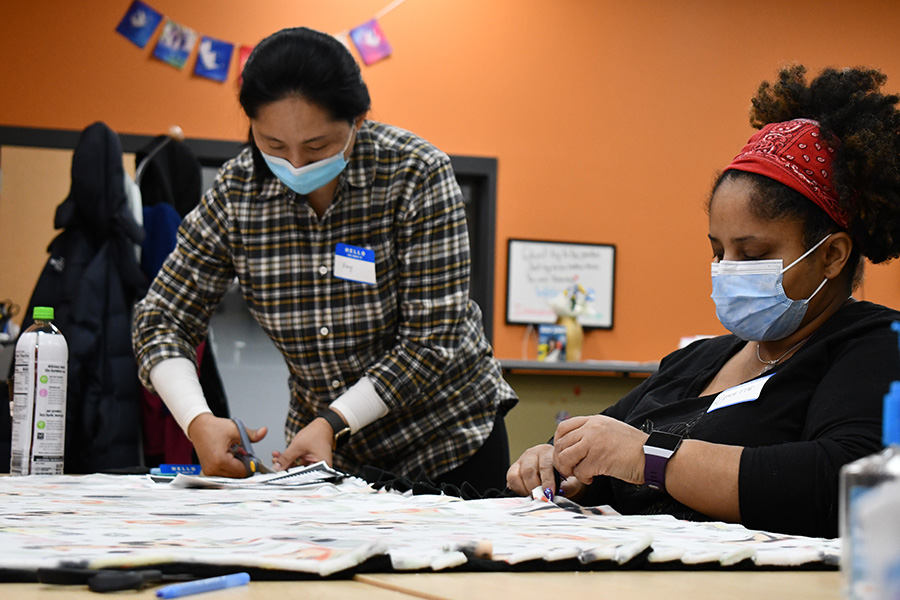 Students work on a blanket as part of a service project on National TRIO Day at Madison College on Feb. 25.