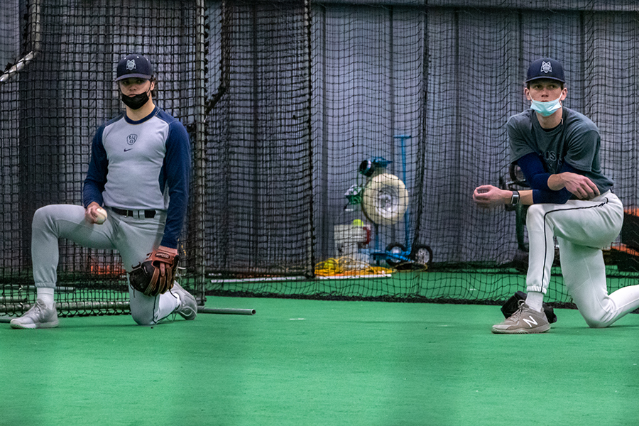 Madison College baseball players stretch at the start of a recent practice held at the GRB Academy facility in Deforest.