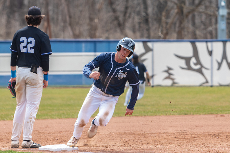 ANDRES SANCHEZ / CLARION Madison College’s Spencer Bartel rounds third base on his way to score during a doubleheader against Bryant & Stratton College at home on April 12. The WolfPack baseball team posted wins of 12-2 and 9-4.
