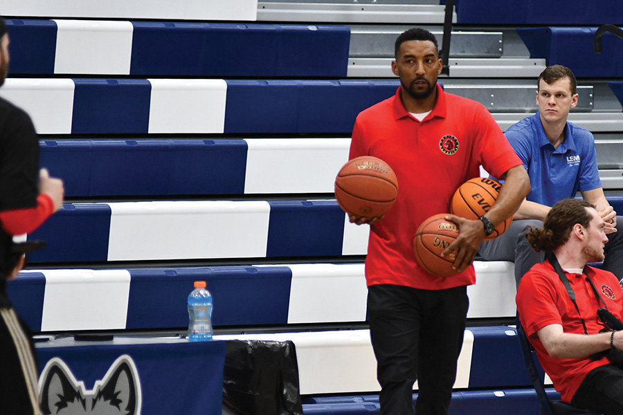 Madison Mavericks owner Roy Boone watches his team warm up before a recent game at Madison College