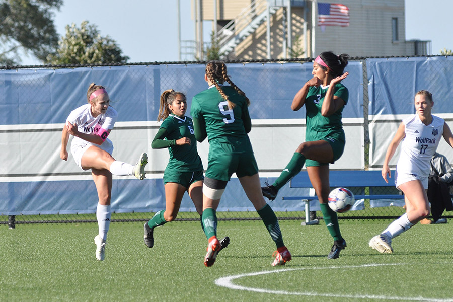 Madison College sophomore Lexi Kulow, left, fires a shot between two College of DuPage defenders during their match at home on Oct. 8.