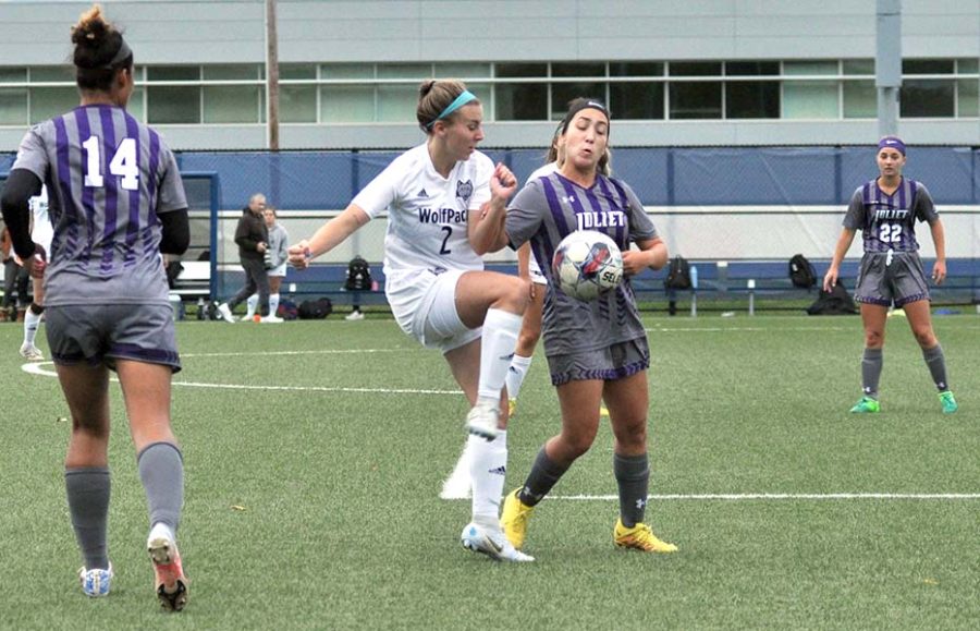 Madison+College+midfielder+Taylor+Peterson+fights+for+control+of+the+ball+against+Joliet+Junior+College+on+Oct.+12.