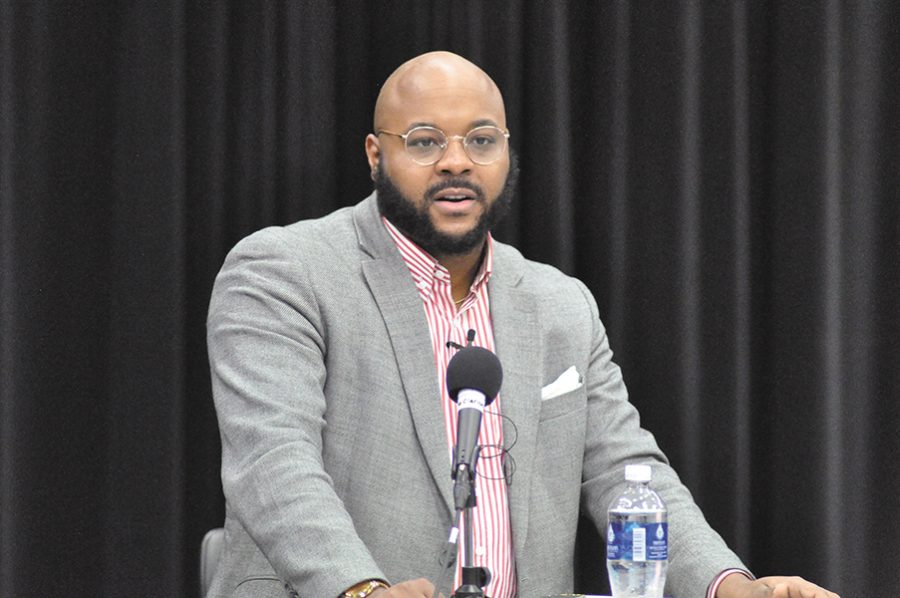 Nate Marshall, a poet and instructor at UW-Madison, answers students’ questions during a reading held in the Truax Campus Studio Theater on Nov. 3. Marshall read from his latest poetry book, “Finna.”