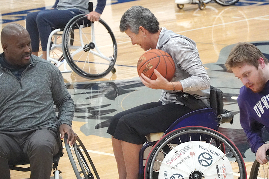 Members of the Madison College Athletic Department compete against the UW-Whitewater Wheelchair basketball team.