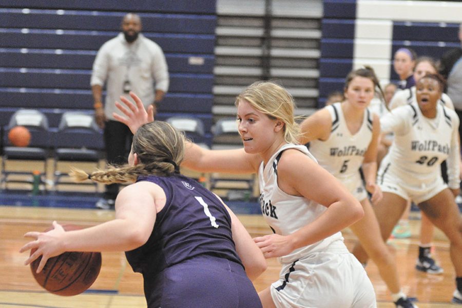 Madison Colleges Cassie Paulsen defends a Rockford University JV player during a game on Nov. 17.