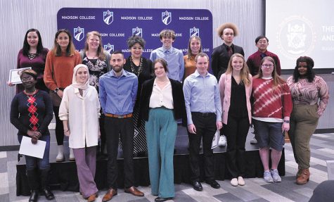 Newly inducted members of Madison College chapter of the National Society of Leadership and Success gather on stage for photos after the induction ceremony on Nov. 28.