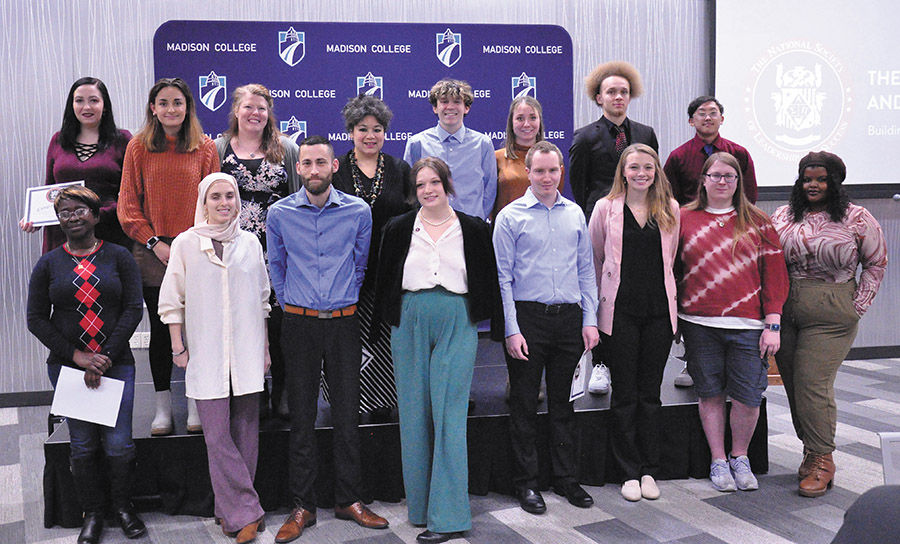 Newly inducted members of Madison College chapter of the National Society of Leadership and Success gather on stage for photos after the induction ceremony on Nov. 28.