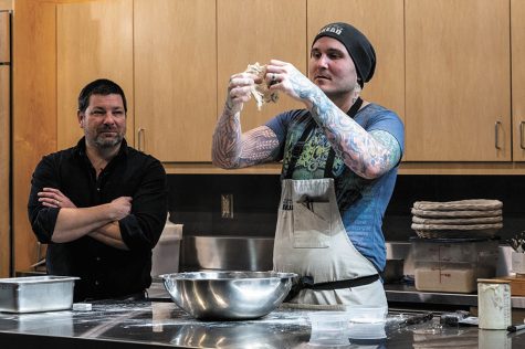 Greg Wade, a Chicago-based artisan baker, works in the Madison College demonstration kitchen as host Kyle Cherek watches during the first Chef Series event of the semester held on Jan. 24 at the Truax Campus.