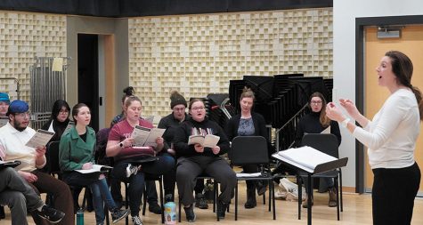 Members of the Choral Collective follow the direction of Melissa Richardson during a rehearsal at the Truax Campus.