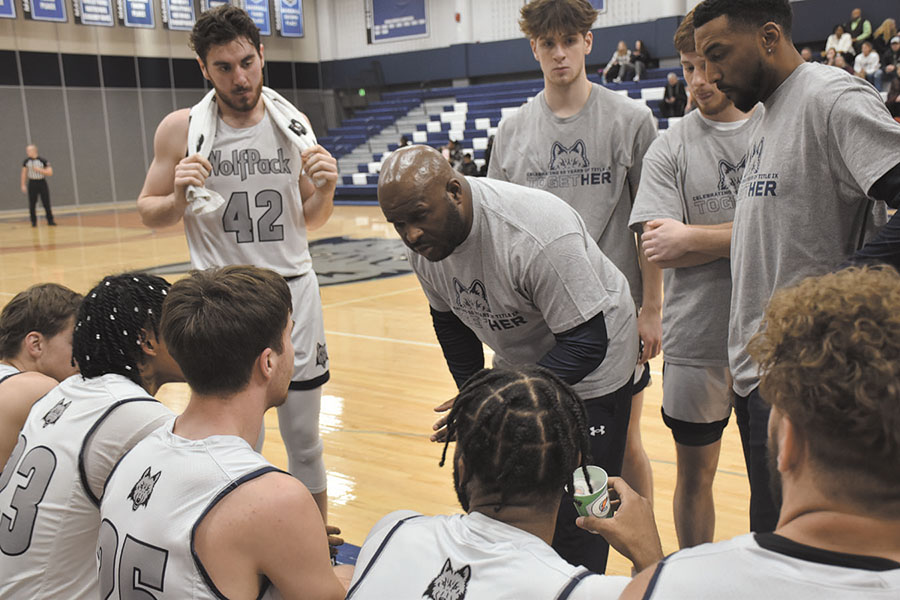 Madison College men’s basketball coach Jason Roscoe speaks to his team during a timeout during a recent game.