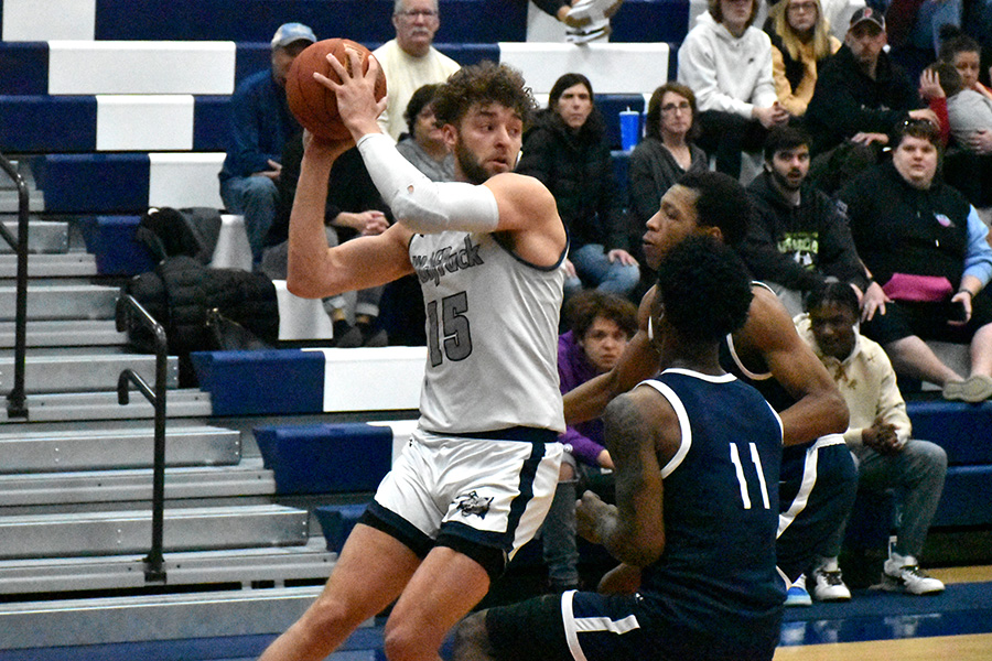 Madison College’s Keith Hoffman looks to pass the ball as a pair of South Suburban College defenders close in during a home game earlier this season.