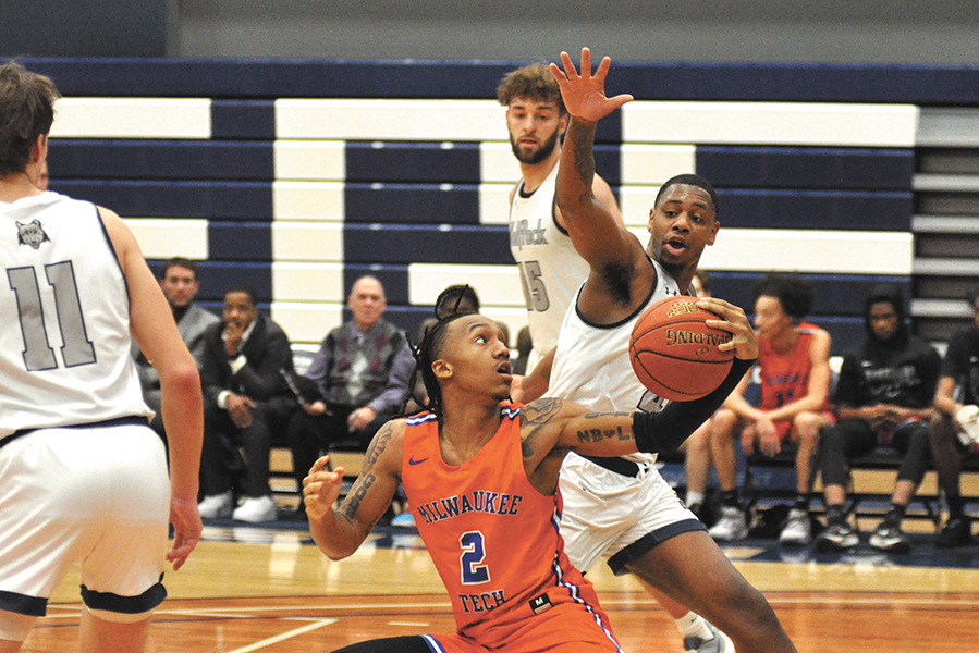 Madison College’s Telin Porter stops a Milwaukee Area Technical College player from driving to the basket during their game on Jan. 24.