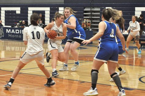 Madison College’s Taylor Ripp drives through the lane against Harper College.