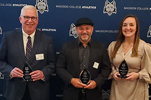 E.G. Scharmka, executive director of the Goodman Foundation, joins Jorge Medina andThresia Elskamp for a photograph at the ceremony honoring newly inducted members of the Madison College Athletics Hall of Fame. Not pictured is Matt Goetz.