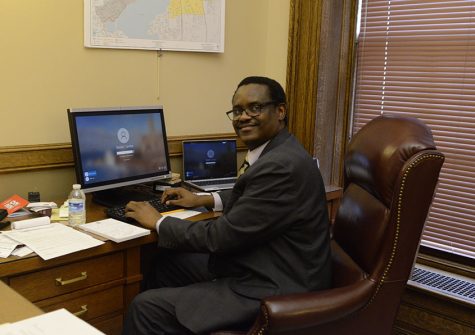 State Rep. Samba Baldeh works from his desk in the State Capitol. (Kelly Feng / Clarion)