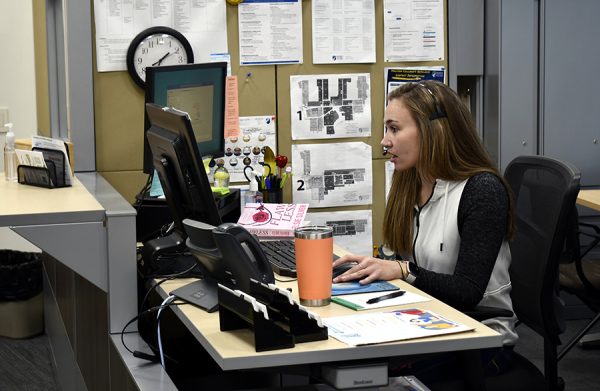 Brittany Czarnecki, a peer coordinator student employee, assists students in the colleges Career and Employment Center.