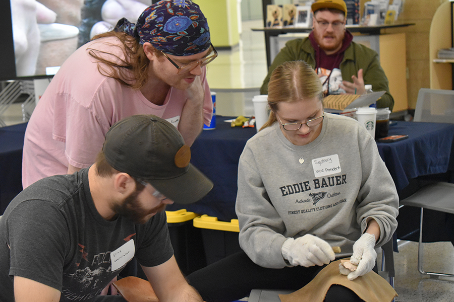 Students participate in an event sponsored by the Four Lakes Anthropological Society recently outside the Truax Student Life Office.