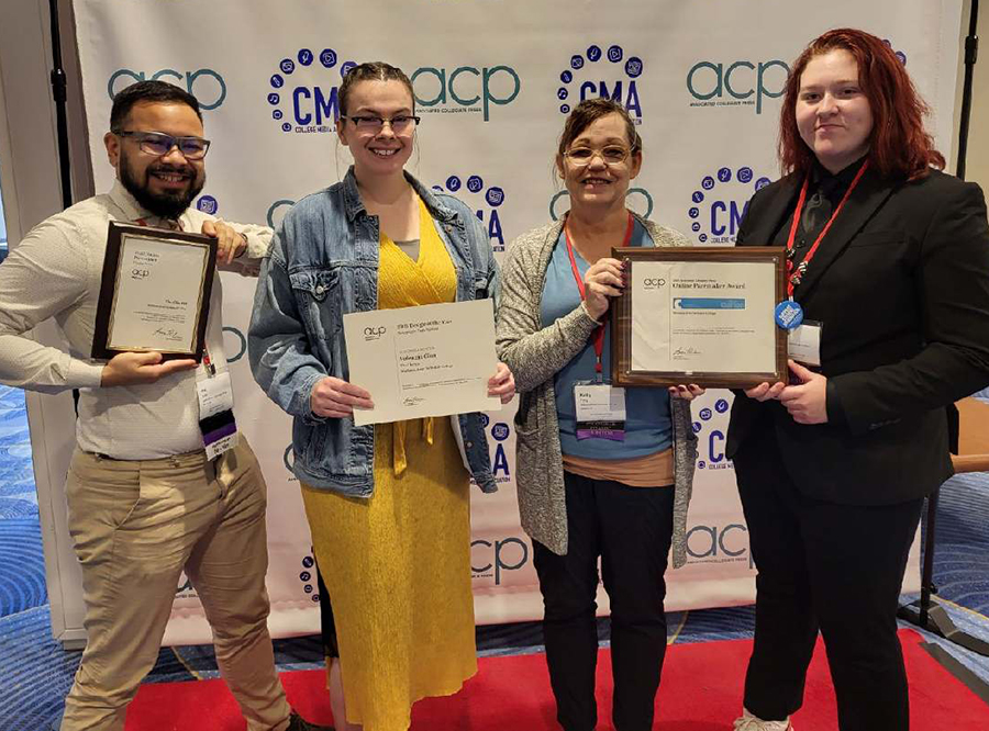 Members of The Clarion staff show the Pacemaker awards they received on Oct. 30. Pictured, from left, are: Kai Brito, Hannah Powell, Kelly Feng, Maddie Thorman.