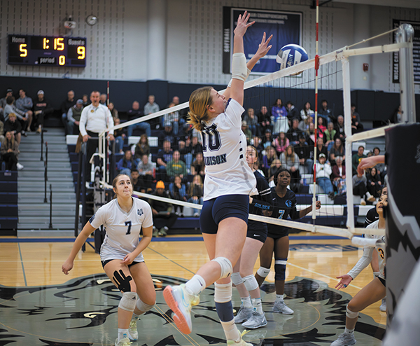 Madison Colleges Gabby Hack blocks an opponent during a recent match at Redsten Gymnasium.