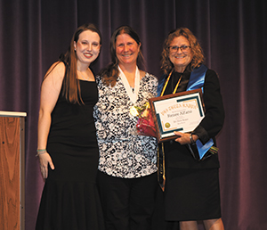 Student Life Director Renee Alfano, right, was presented with an honorary Phi Theta Kappa membership during the honor society’s induction ceremony in November. She is pictured with PTK officers Morgan Witthun and Barbara Bahr. 