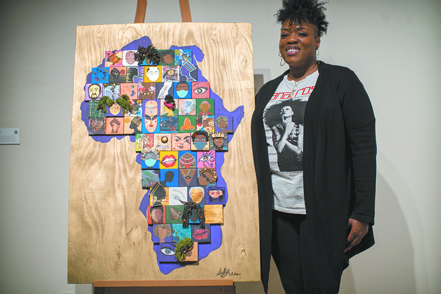 Artist Monica Mims discusses her mixed media artwork, “Happening,” that is part of the “Restoring the Black Woman” art exhibit on display in the Truax Campus Gallery.