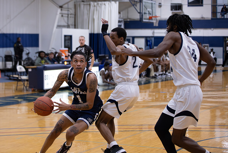 Madison College’s Deante Luster drives to the basket against South Suburban College on Feb. 29 during his team’s NJCAA Division II regional game.