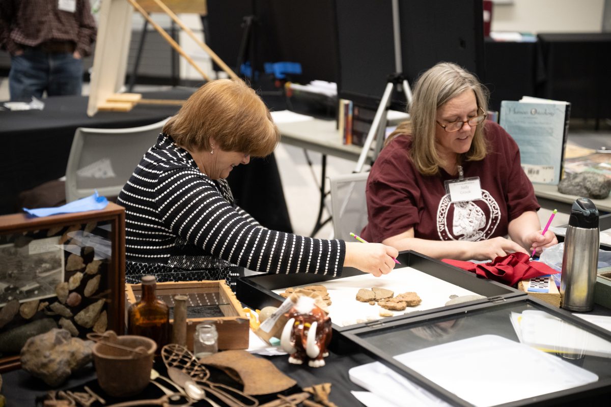 Volunteers help exhibit the artifacts 