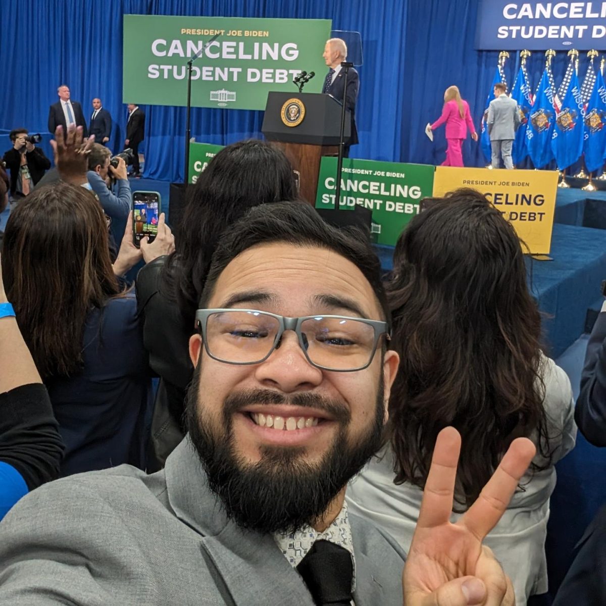 Kai+Brito+takes+a+selfie+with+United+States+President+Joe+Biden+in+the+background.+