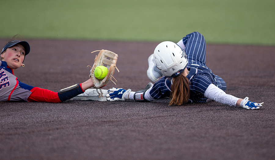 Madison Colleges Rylee Rogers (14) steals second base.