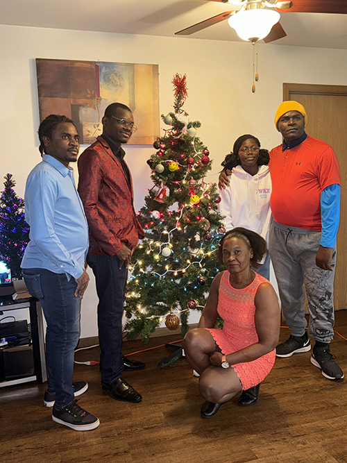 Johvany Michaud, second from left, is joined by his family for a Christmas photo in December 2023.
