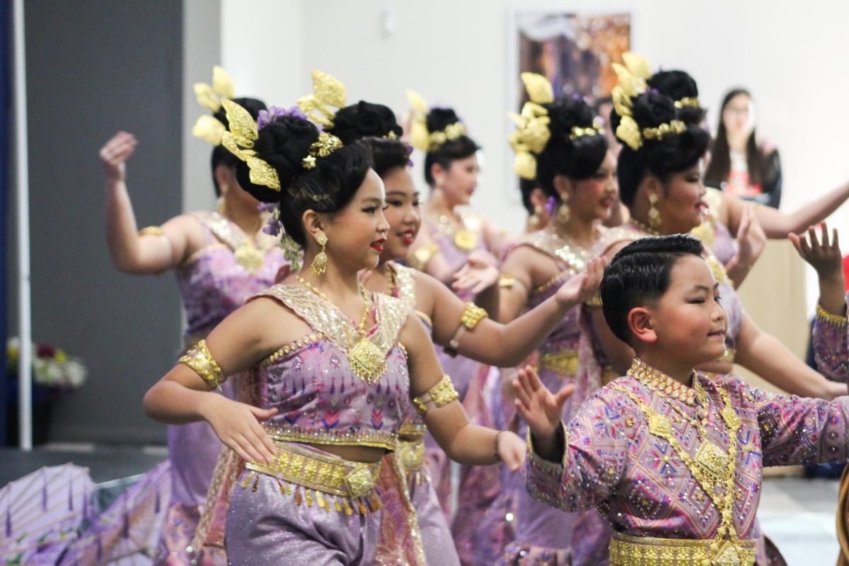 A youth dance troupe performs at the Madison College Hmong New Year event.