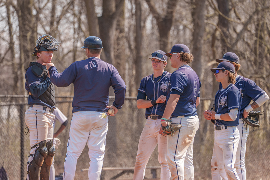 Madison College baseball coach Mike Davenport talks to the infield during a timeout in a recent home game.