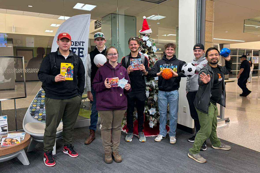 BPA members show some of the toys they donated to Santa’s Wish List for one of the group’s community service activities.