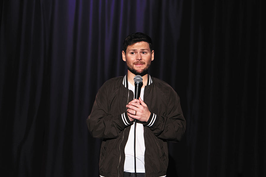 Comedian Drew Lynch during a stand-up performance.