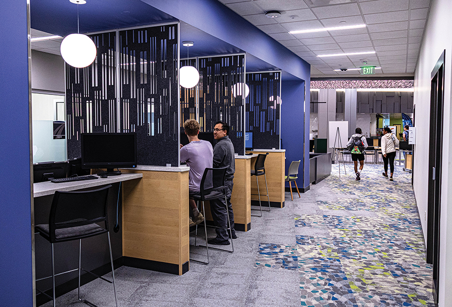 Students and staff can be seen in a newly renovated section of the Student Services are at the Truax Campus.