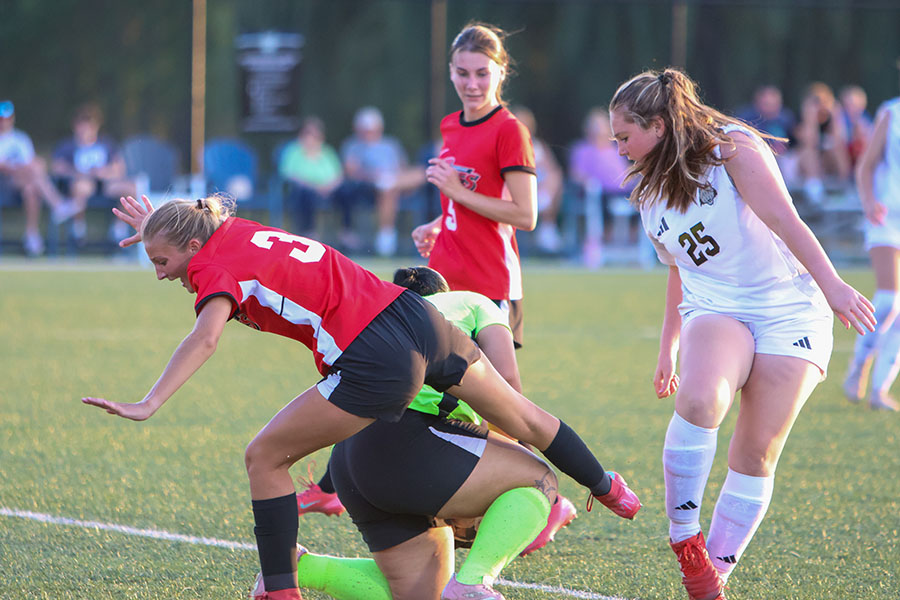 Waubonsee Community College women's soccer players tumble as the goalie stops a Madison College shot during their match on Sept. 27.
