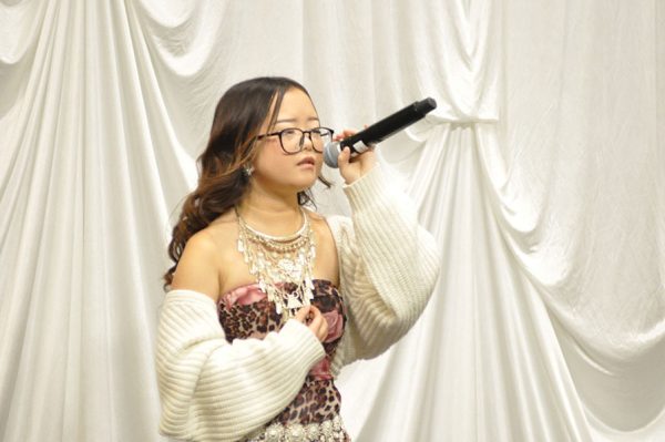 Photo of a Hmong singing contest competitor at the Madison College Hmong New Year Celebration.
