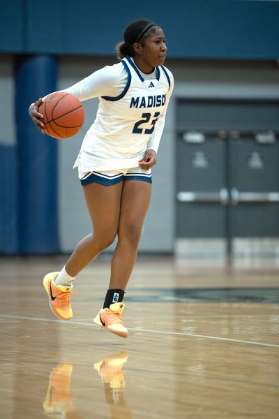 Serinity Metcalfe (23) brings the ball across midcourt against Blackhawk Technical College on Jan. 10.