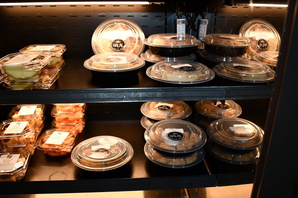 Pre-packaged food containers on a shelf.