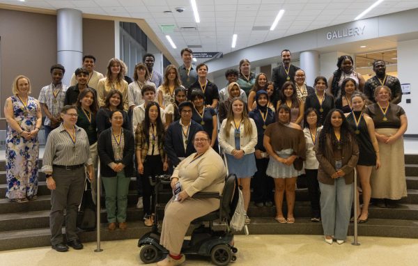 PTK inductees wearing their medallions pose for a photo.